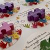Personalized colored magnetic puzzle tiles with names on school inclusion cards